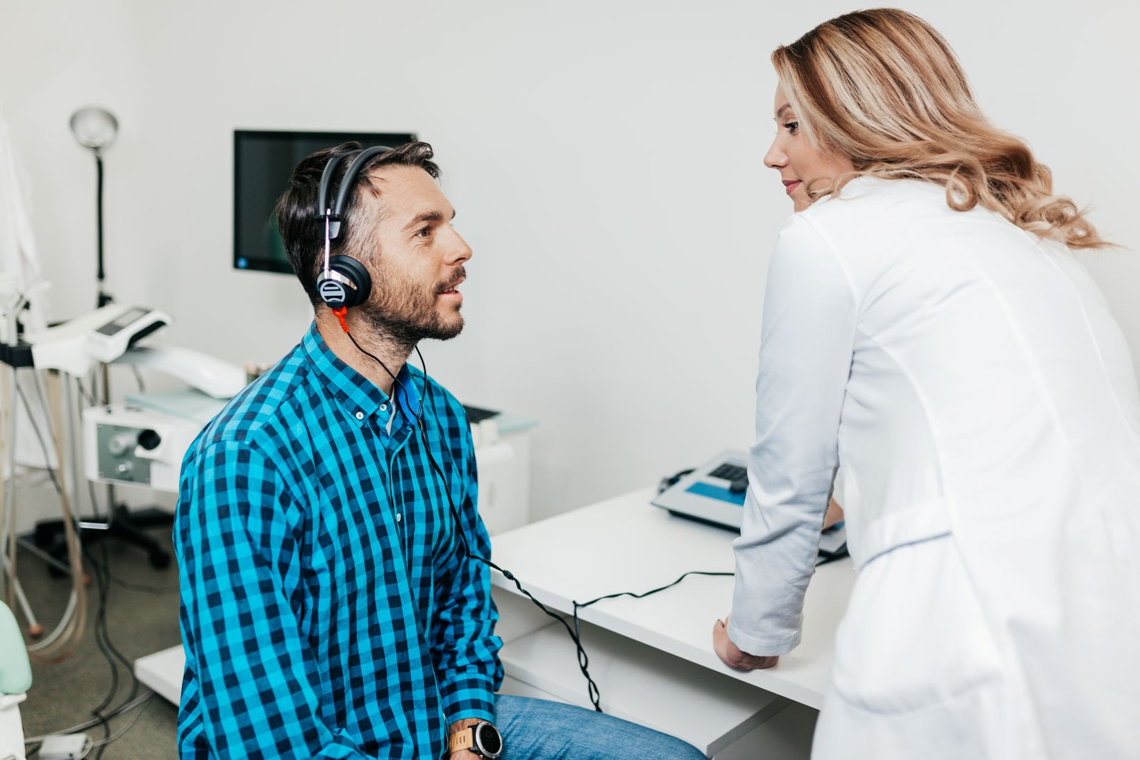 man being tested and treated for hearing loss